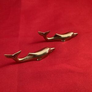 Two brass dolphins (knife holder?}